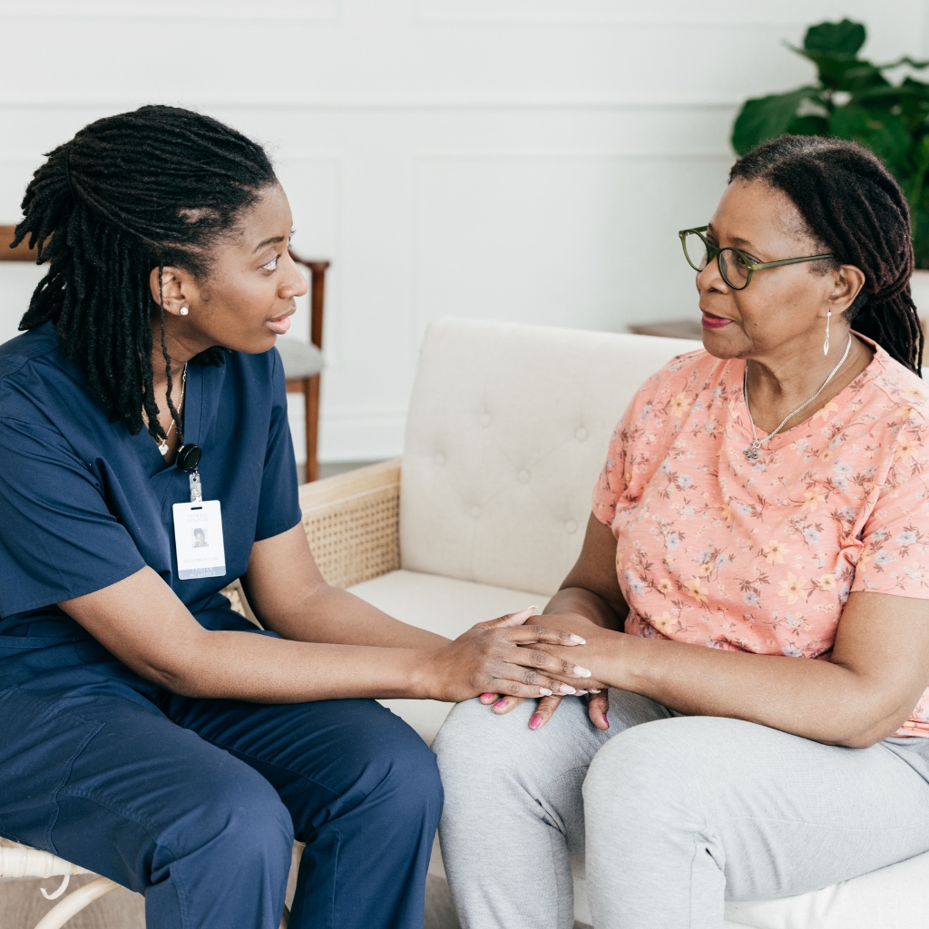 A Heart House caregiver spending time with a resident