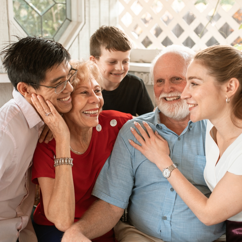 A caregiver speaking with a resident's family member
